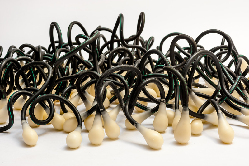 Pods (2013) Detail. Wax, dairy hose, aluminium wire.